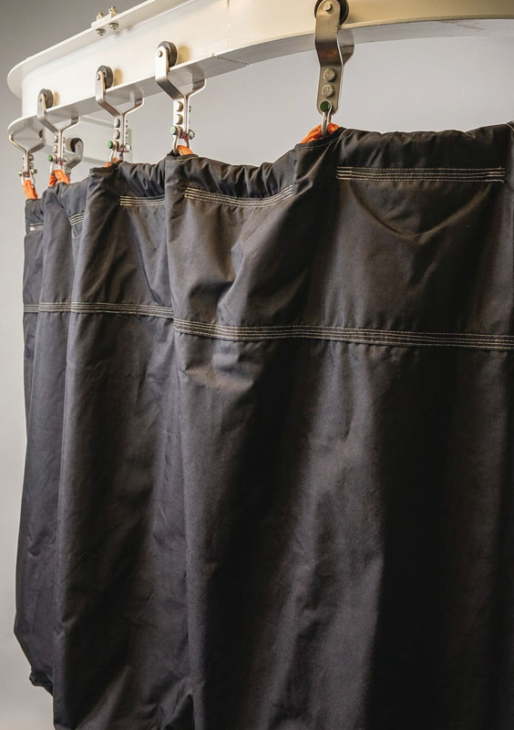 StopForce blast curtain installed around a high-pressure manifold